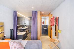 Giường trong phòng chung tại Nomad Design & Lifestyle Hotel