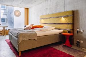 Giường trong phòng chung tại Nomad Design & Lifestyle Hotel