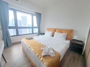 Ένα ή περισσότερα κρεβάτια σε δωμάτιο στο Agile Malaysia Apartment KL +81 φωτογραφίες