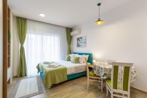Postel nebo postele na pokoji v ubytování Sunny side Wellness Resort & Spa - Cascade + 34 fotografií