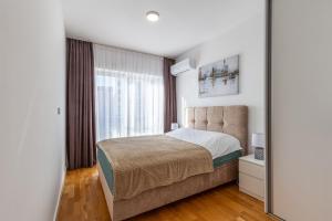 Postel nebo postele na pokoji v ubytování Sunny side Wellness Resort & Spa - Cascade