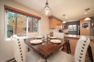 a dining room with a wooden table and chairs at Beaver Village Unit #1624 in Winter Park +14 photos