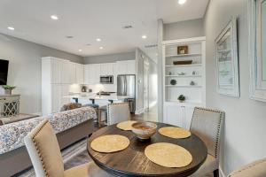 a dining room and living room with a table and chairs at Reserve at St Charles Bay Reserve Lane Townhome 202 in Rockport