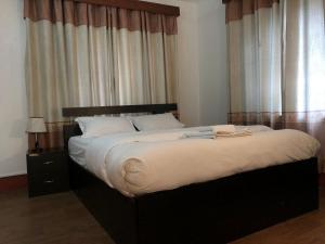 Un ou plusieurs lits dans un hébergement de l'établissement Apartment in Nepal