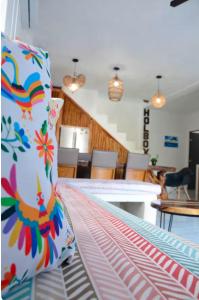 a bed with a pillow on top of it in a room at Casa Emma fantástica con acceso a beach club ! in Holbox Island