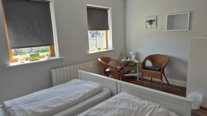 Postel nebo postele na pokoji v ubytování Sheepviewhouse Jamie