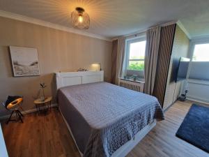 Katil atau katil-katil dalam bilik di Ferienwohnung Südstrand