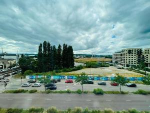 a parking lot with cars parked in a parking lot at Rouen Confort - 395 in Rouen