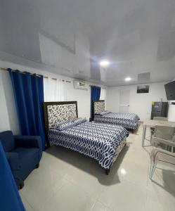 Voodi või voodid majutusasutuse Posada Three Cay Suites toas