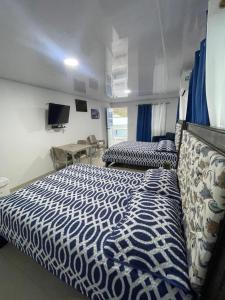 Voodi või voodid majutusasutuse Posada Three Cay Suites toas