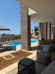 a view of a swimming pool from a villa at Turquoise Pool Side Thymus Resort in Himare