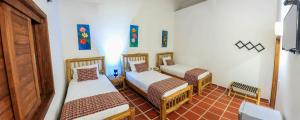 Postel nebo postele na pokoji v ubytování Hotel Brisas La Gaviota Mariquit-Tolima