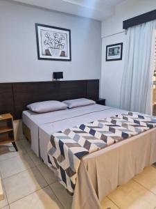 Una cama o camas en una habitación de Quarto Double