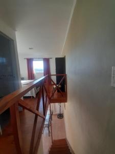 a room with a desk and a television and a window at Ayres Serranos in Villa Carlos Paz