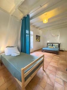 Voodi või voodid majutusasutuse Sweet Villa, piscine, vue panoramique sur la mer, proche plage, Sainte Luce toas +53 fotot