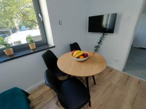 Μια τηλεόραση ή/και κέντρο ψυχαγωγίας στο Apartamenty Monte Cassino