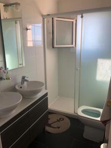 a bathroom with a sink and a shower and a toilet at Costa Brava - Roses - Terrace & sea view in Roses