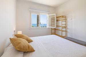 En eller flere senge i et værelse på Playa Marina + 10 billeder