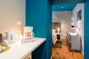 Posteľ alebo postele v izbe v ubytovaní Riva Luxury Rooms