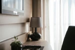 Televízia a/alebo spoločenská miestnosť v ubytovaní Boutiquehotel Minigolf