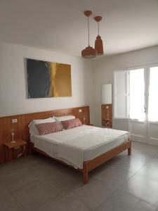 Postel nebo postele na pokoji v ubytování A est b&b Otranto