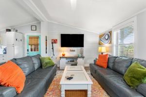 a living room with a couch and a table at The Tip Sea Mermaid in Salvo