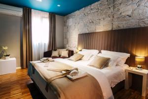Posteľ alebo postele v izbe v ubytovaní Riva Luxury Rooms