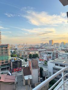 a view of a city from a balcony at n'PrishtinëApartments - Apartment 401 in Prishtinë