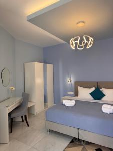 Postel nebo postele na pokoji v ubytování Myrto Hotel