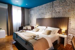 Posteľ alebo postele v izbe v ubytovaní Riva Luxury Rooms