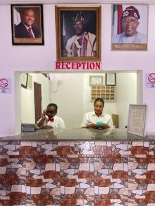 two pictures of a woman brushing her teeth in a bathroom at Abuja Bays Garden Hotel Ltd in Mama