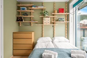 Postel nebo postele na pokoji v ubytování Modern & Spacious City Apartment