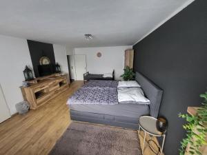 Кровать или кровати в номере Marcel's Appartement