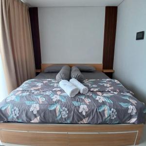 Ένα ή περισσότερα κρεβάτια σε δωμάτιο στο Apartment in Nongsa Palm Spring