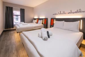 Ένα ή περισσότερα κρεβάτια σε δωμάτιο στο easyHotel Leeds