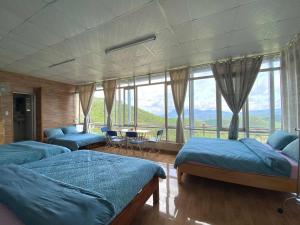 Postel nebo postele na pokoji v ubytování Nắng Xanh - Shanti Homestay Đà Lạt + 7 fotografií