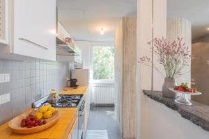 a kitchen with a bowl of fruit on the counter at Casa Corbu by Rent All Como in Blevio