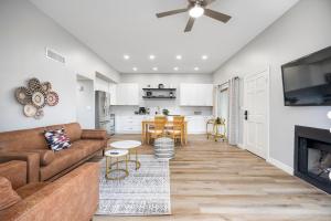 a living room with a couch and a fireplace at Old Town Southwest Style 2BR Condo with Pool and Hot Tub in Scottsdale