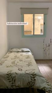 Postelja oz. postelje v sobi nastanitve Go Hostel