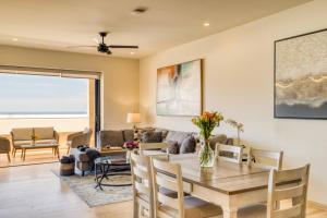 a living room with a table and a couch at Group Apt 13 16, no view, 3BR, 12 pax in Cabo San Lucas
