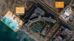 an overhead view of a beach with a sign and the ocean at Group Apt 13 16, no view, 3BR, 12 pax in Cabo San Lucas