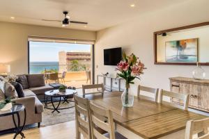 a living room with a table and a couch at For couples, petfriendly 2 BR ocean view 18 4pax in Cabo San Lucas