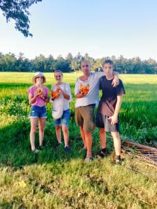 a group of people standing in a field at Tranquil Sanctuary Yala in Tissamaharama
