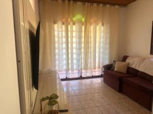 TV a/nebo společenská místnost v ubytování Residencial Divina