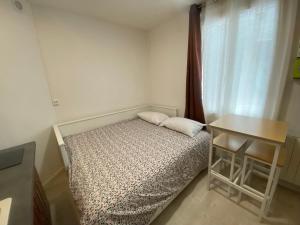 Ένα ή περισσότερα κρεβάτια σε δωμάτιο στο Tiny Nest 42