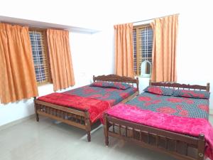Ένα ή περισσότερα κρεβάτια σε δωμάτιο στο Blisskasa Home Stay