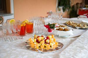 a table with a plate of food on a table at Albergo Italia in Molveno