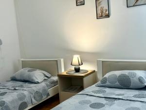 Postel nebo postele na pokoji v ubytování Maribelle Apartments