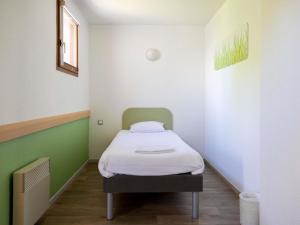 Postel nebo postele na pokoji v ubytování ibis budget Narbonne Sud A9/A61