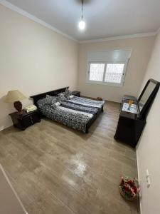 Voodi või voodid majutusasutuse Cozy Condo in Rabat toas